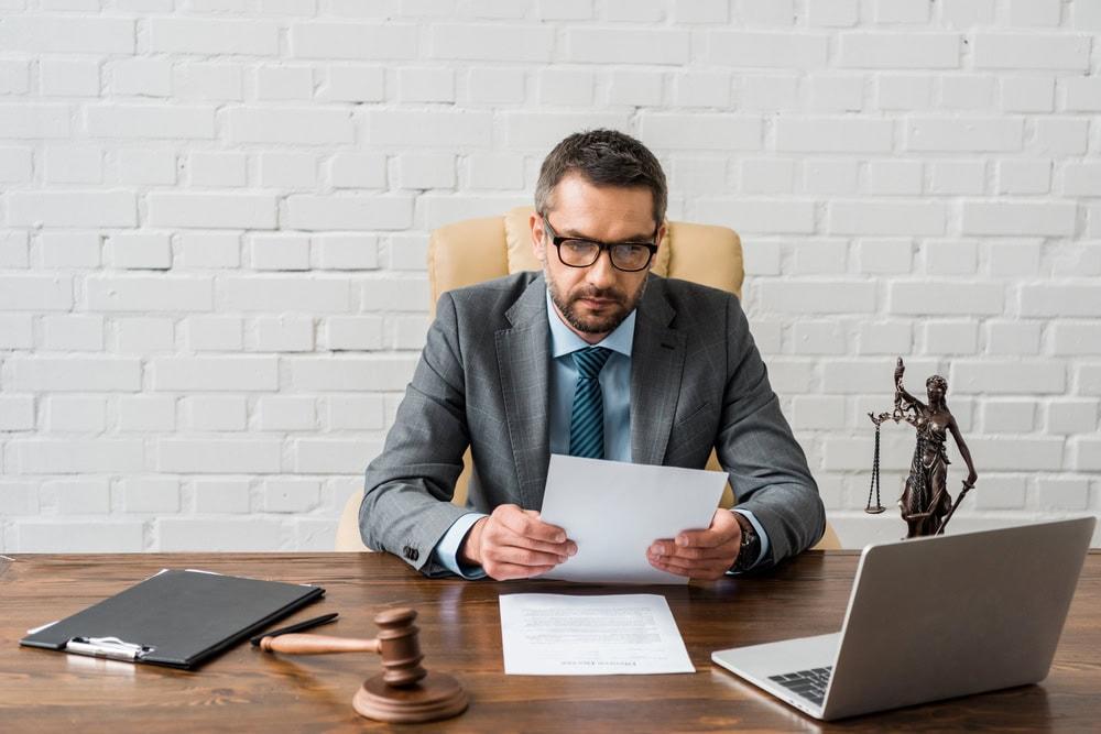Personal injury attorney reviewing car accident evidence to support a legal claim.
