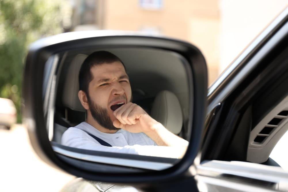 Attorney meeting with client about drowsy driving accident and car crash injuries.