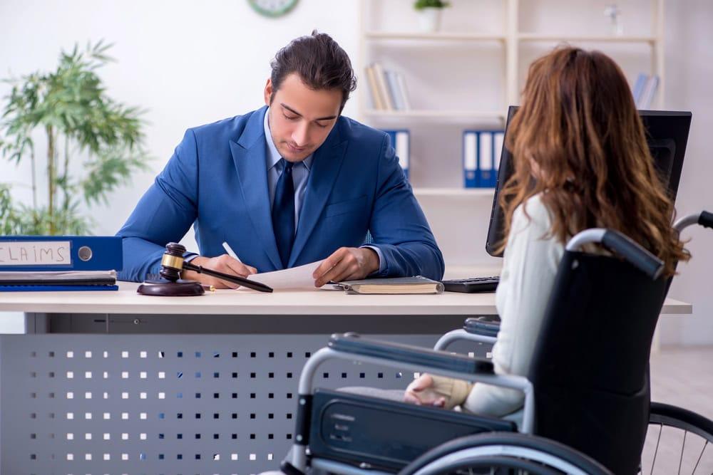 Lawyer guiding injured client on what doctor to see after a car accident for proper treatment