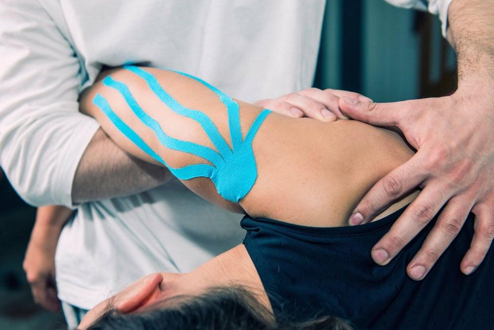 Attorney discussing a physical therapy settlement with an injured client