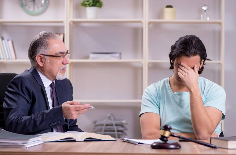 Chicago car accident lawyer explaining legal options to injured client.