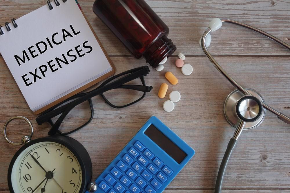 Chicago lawyer helping clients file an AAA car insurance claim for medical bills.