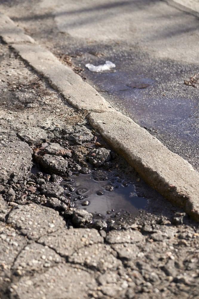 Medical bills and documents following a personal injury from a pothole-caused accident.