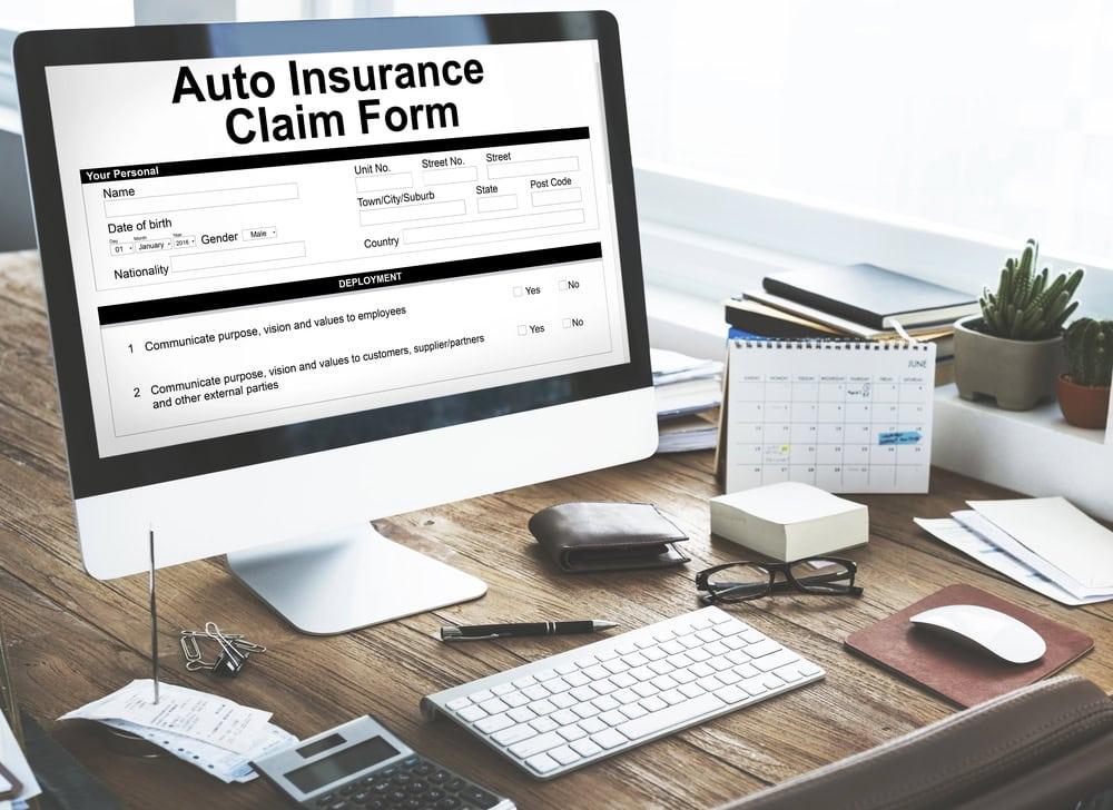 Chicago attorney helping clients with Erie car insurance claim process.