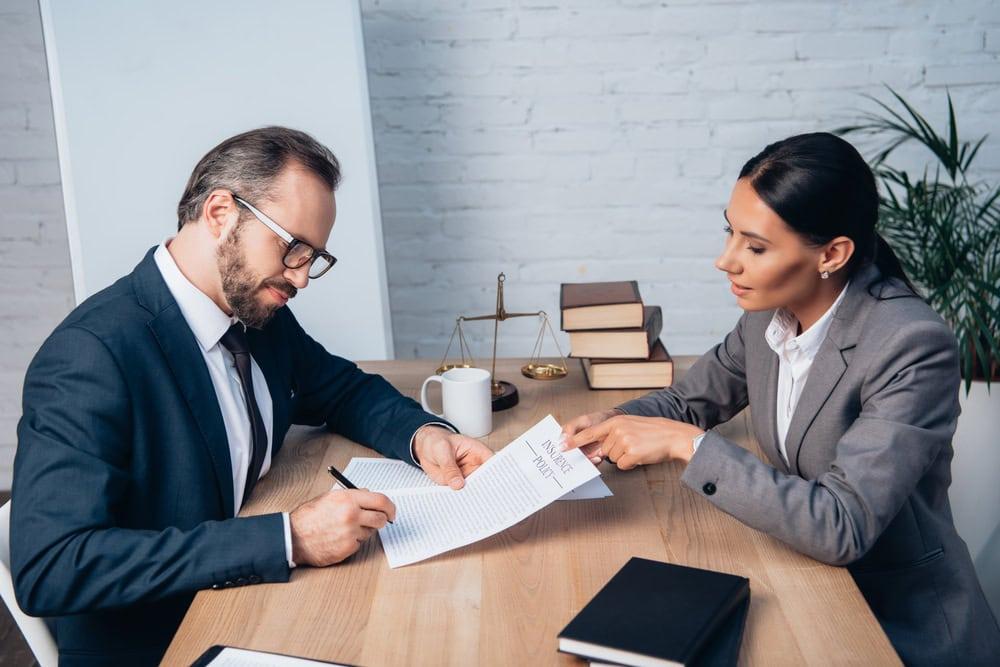 Chicago Car accident attorney negotiating settlement with insurance adjuster.