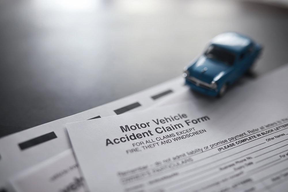 Car accident attorney reviewing evidence after a deposition in a personal injury lawsuit.