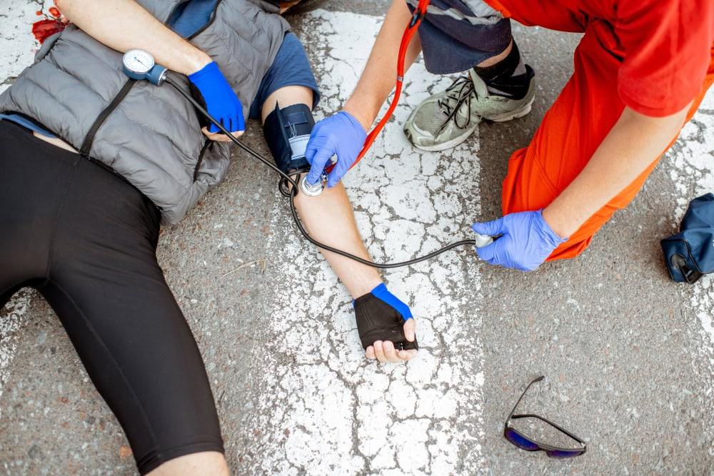 Injured cyclist receiving medical attention after a bicycle accident in Chicago.