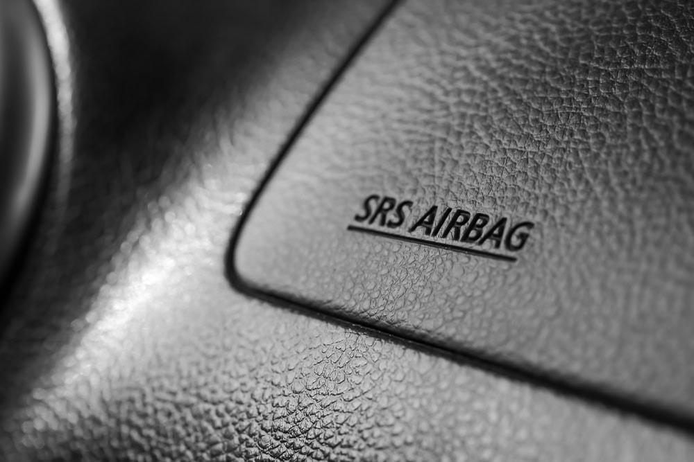 Attorney reviewing car accident case involving injuries from a faulty airbag