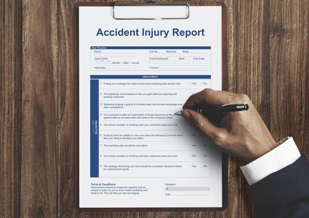 Car accident law firm reviewing police reports and medical records.