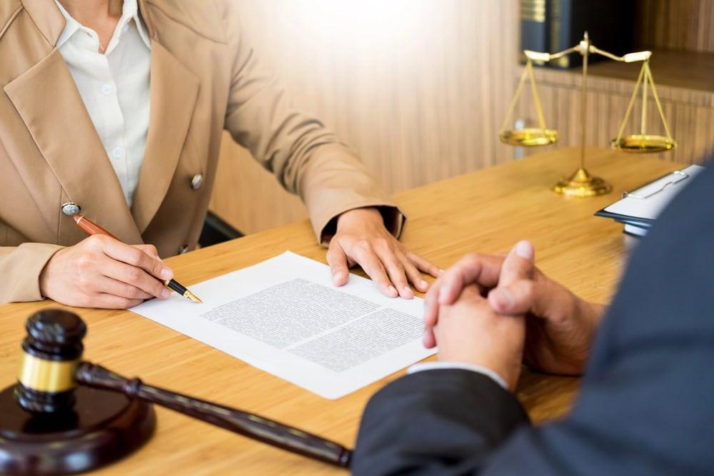 Chicago car accident lawyer reviewing expert witness report with client.