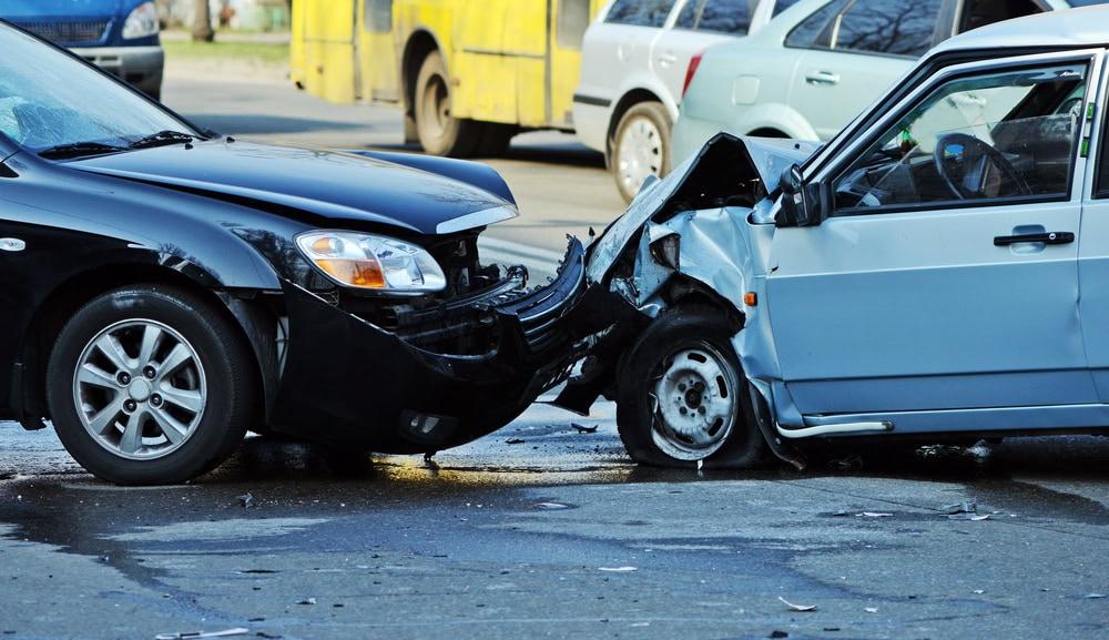 Attorney assisting client with insurance claim after a car crash involving another driver