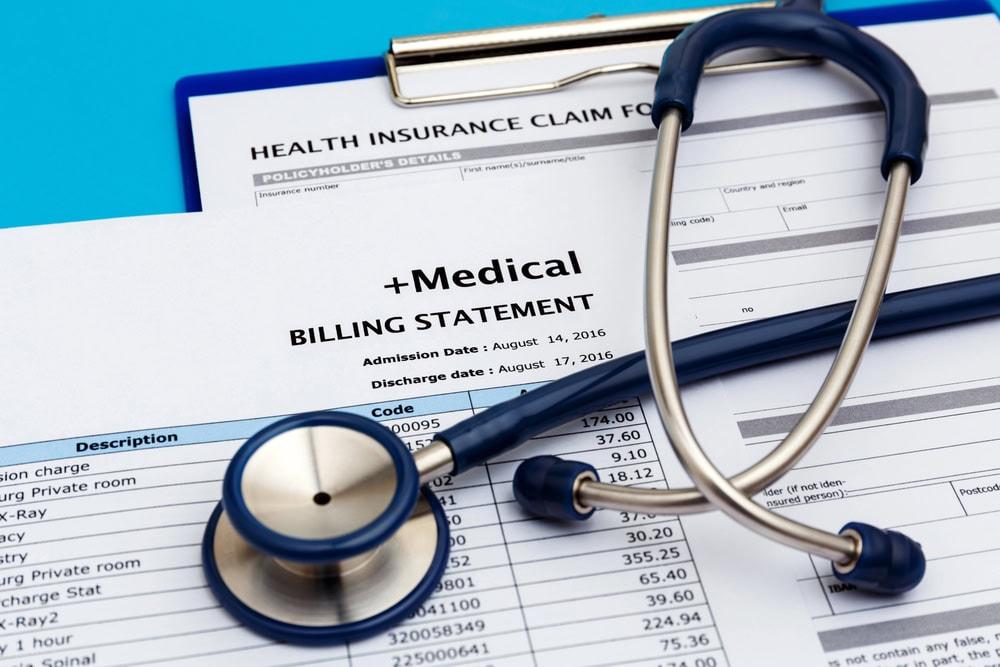 Car accident lawyer in Champaign assisting clients with medical bills and insurance claims.