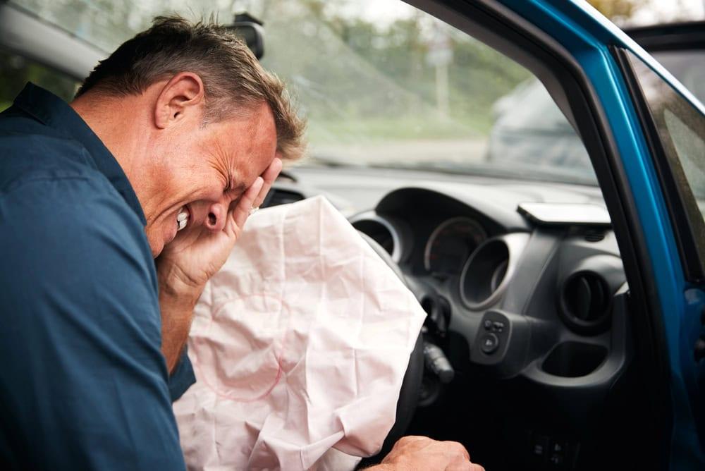 Burn and bruise injuries caused by airbag deployment in a car accident
 