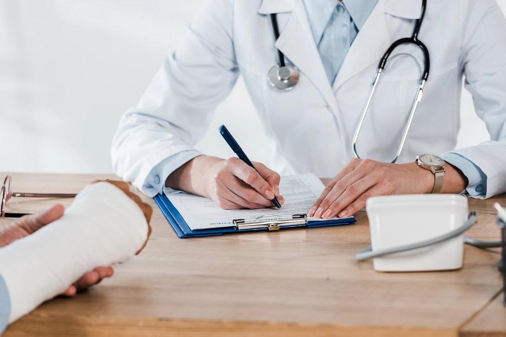 Attorney discussing doctor options with a client after a car accident injury