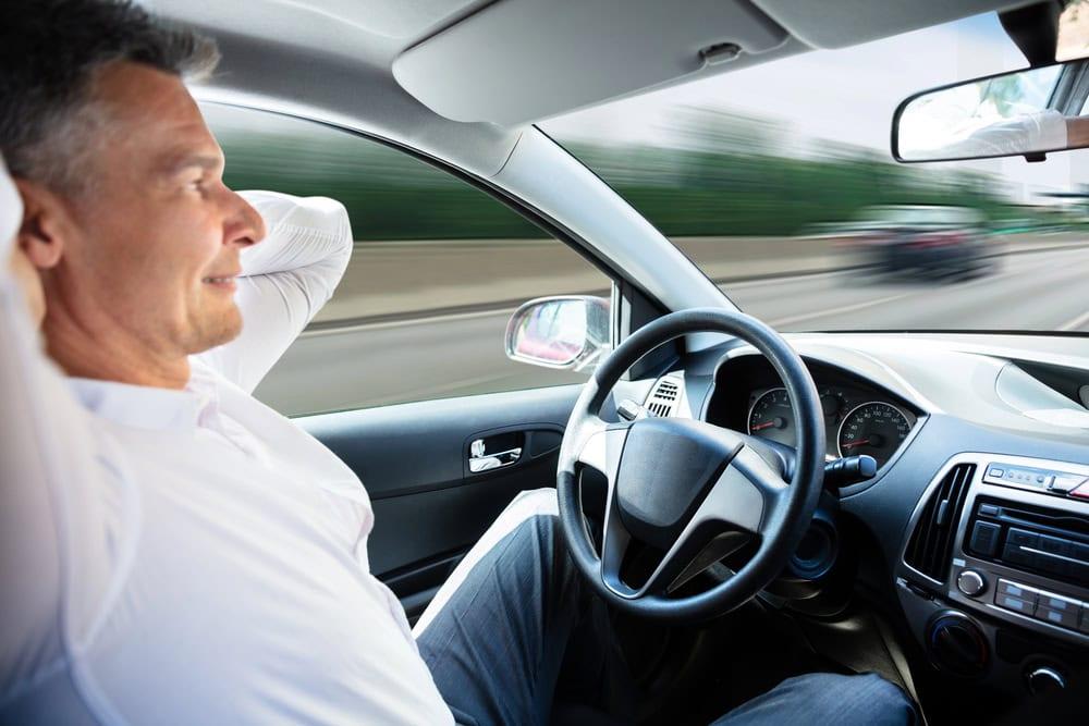 Driver distracted by phone and in-vehicle tech causing an accident.