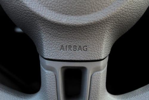 Defective airbag deployment in a car accident