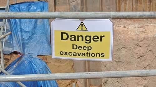 Danger Sign Posted to Avoid Construction Site Accidents in Excavated Areas