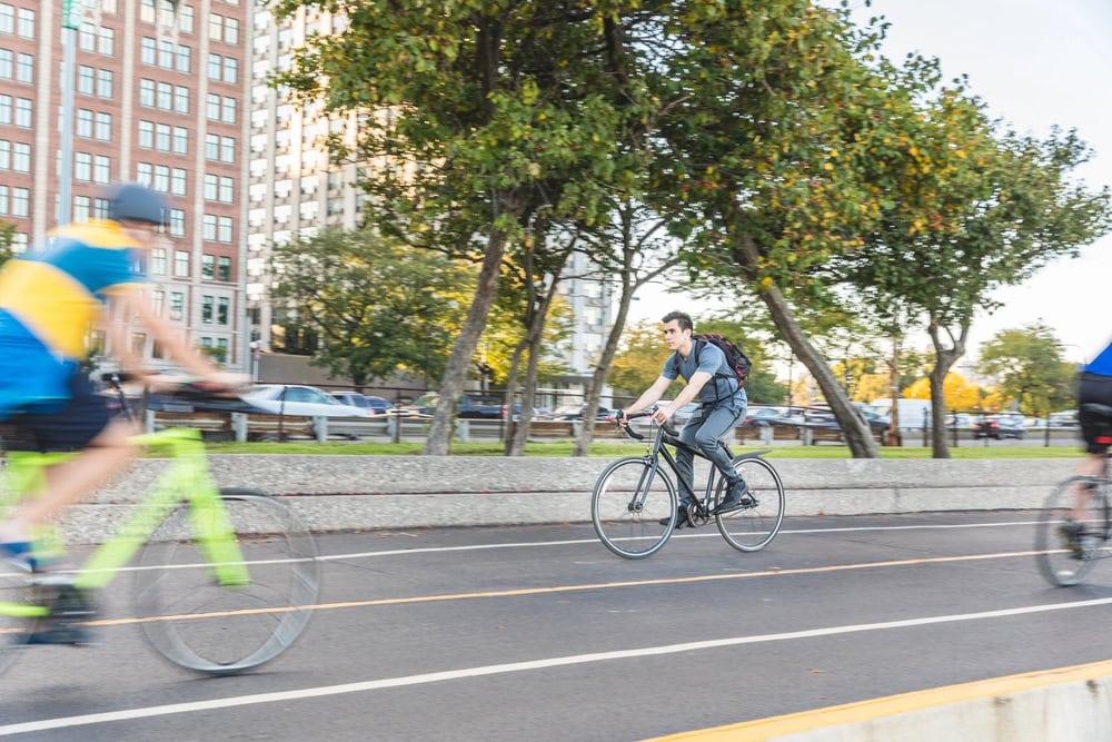 A lawyer reviewing bicycle and vehicle proceeding laws for cyclists and drivers.