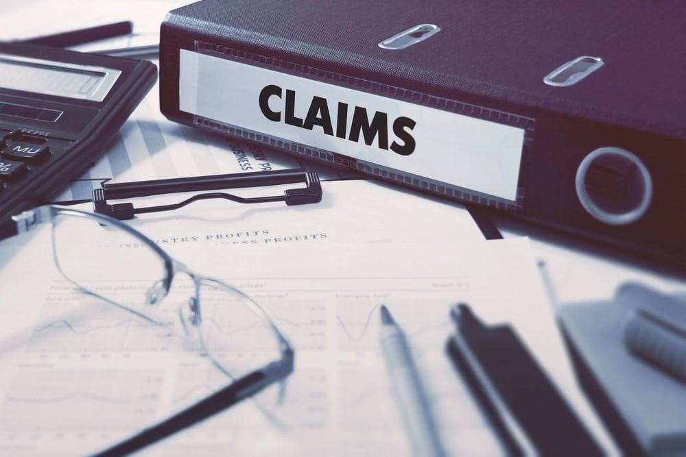 Chicago car insurance claim lawyer reviewing medical bills after a car accident