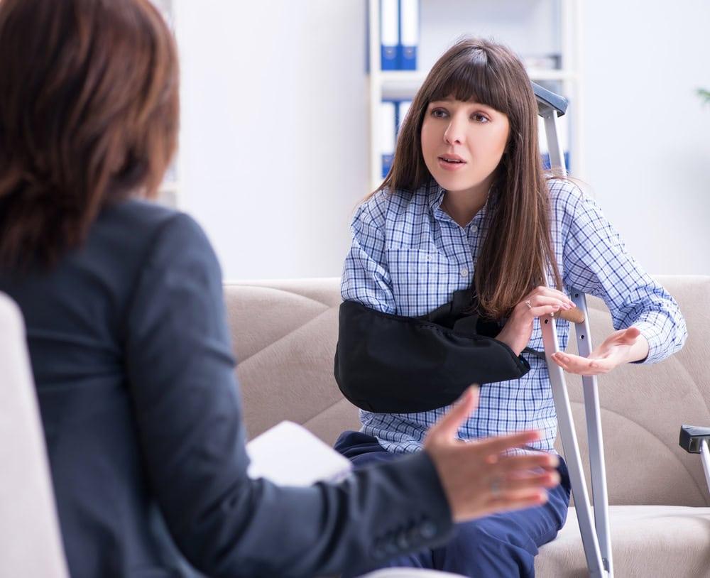 Attorney discussing a personal injury lawsuit involving delayed medical care after a car accident