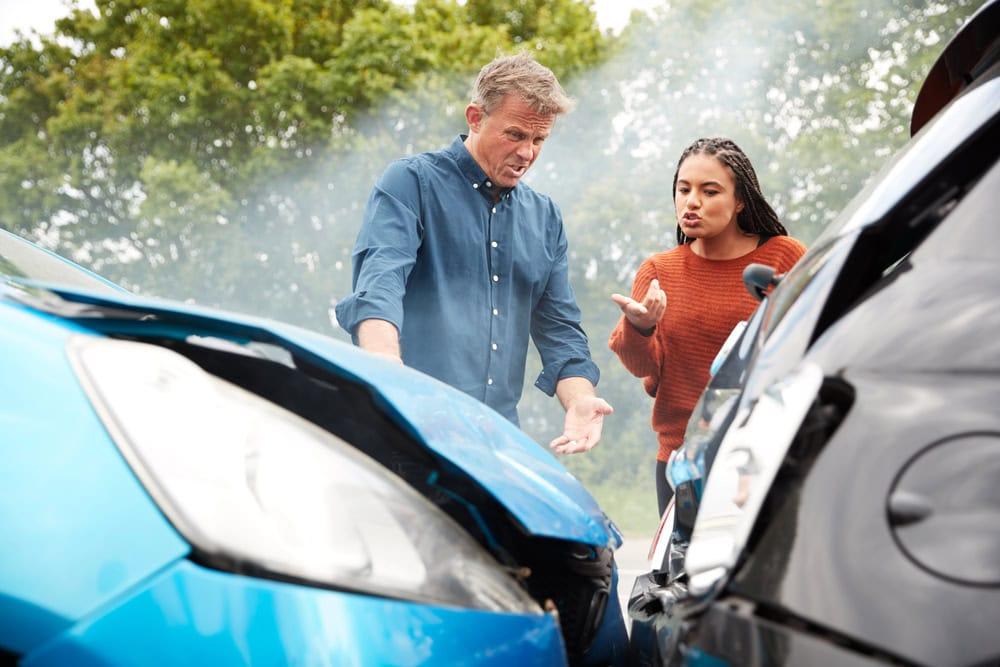 Attorney helping client file car accident insurance claims against the insurance company
