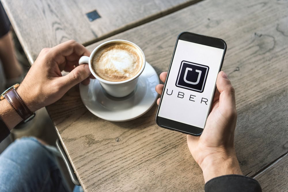 Car accident attorney helping a client handle an insurance company dispute after an Uber-related crash.