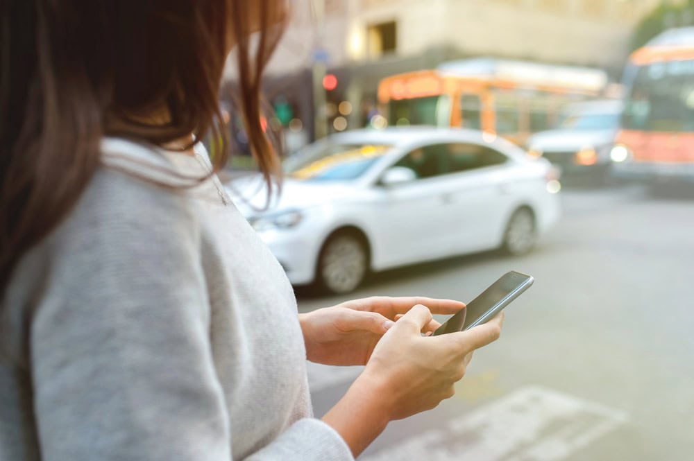 Waukegan Uber accident lawyer discussing a personal injury claim with a client after a car crash.